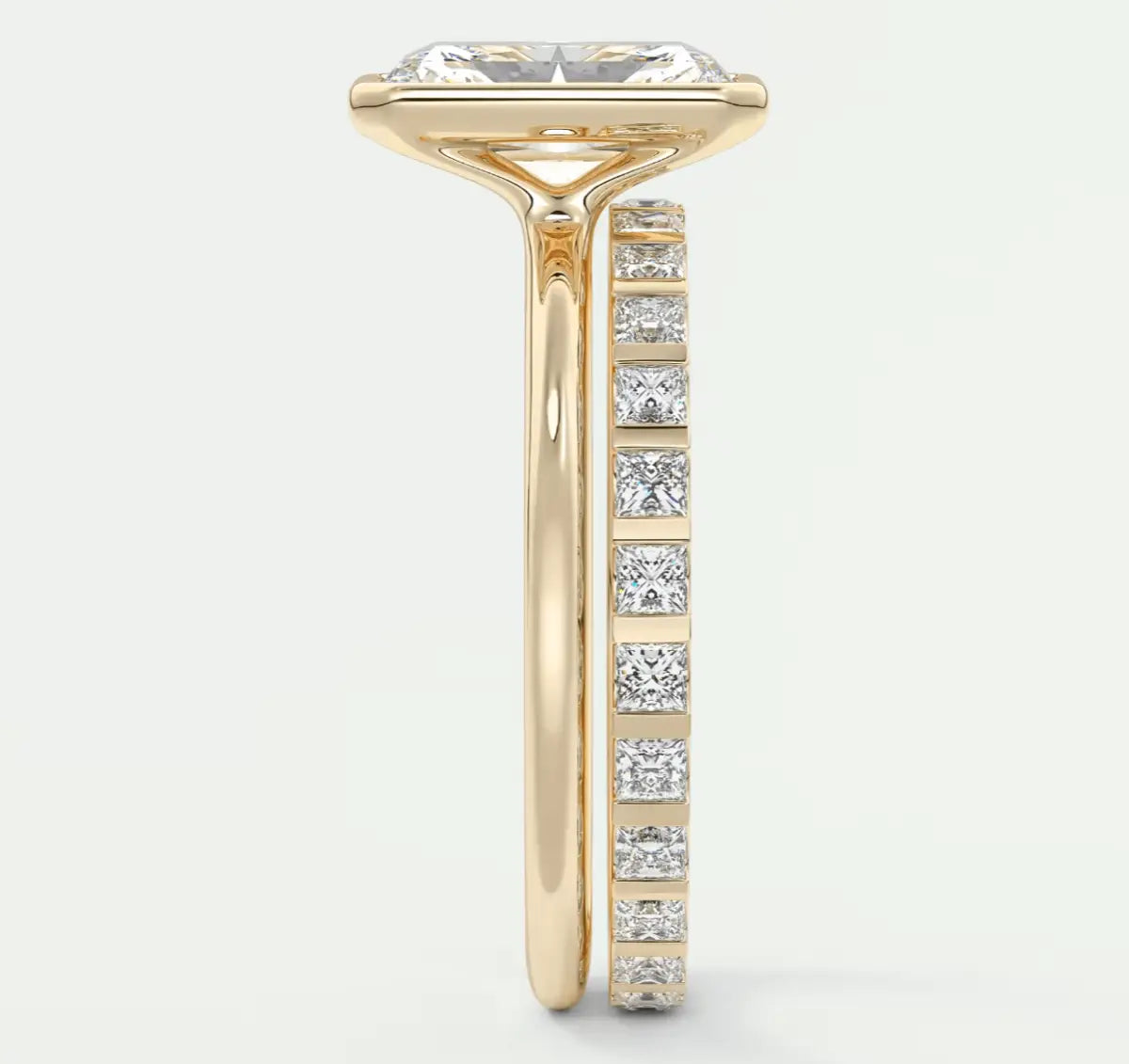18k yellow gold engagement ring with princess-cut diamonds.