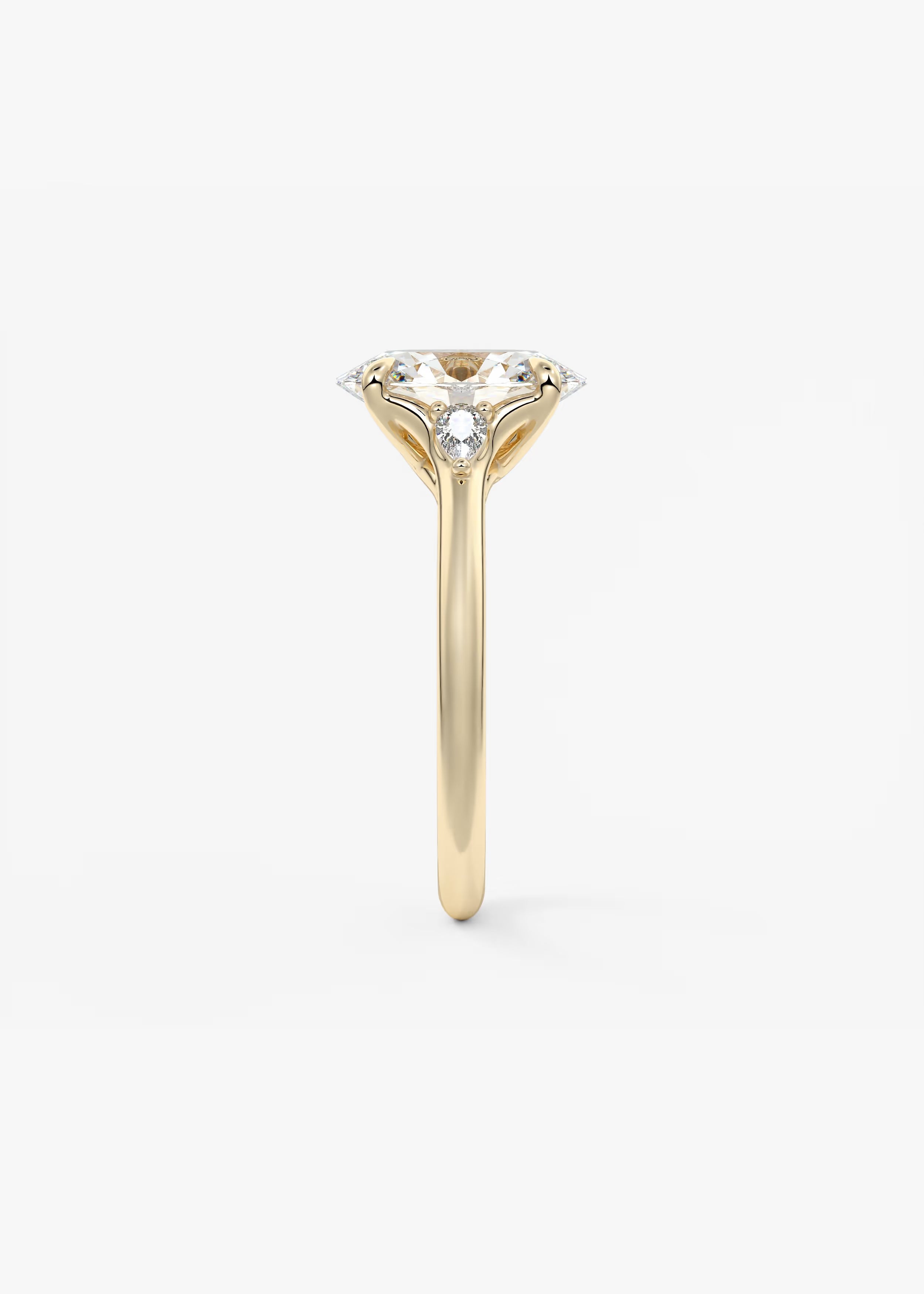 Cassia – Oval Trilogy with Pear Side Stones