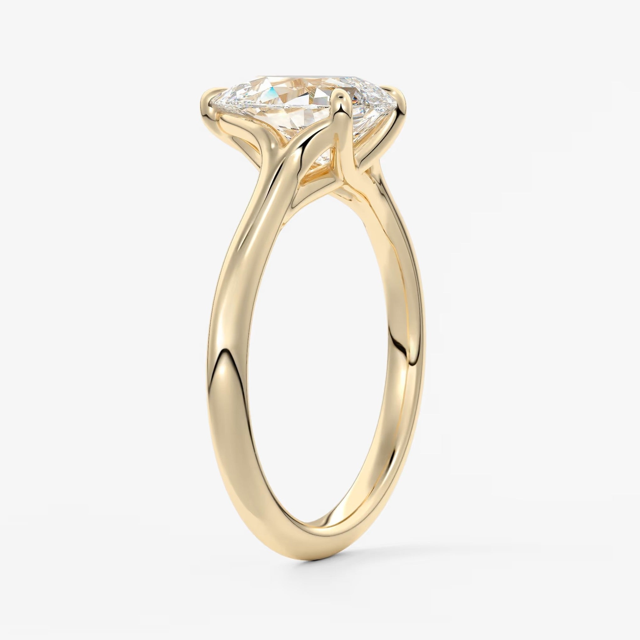 Cassia – pear solitaire with triple-claw prongs