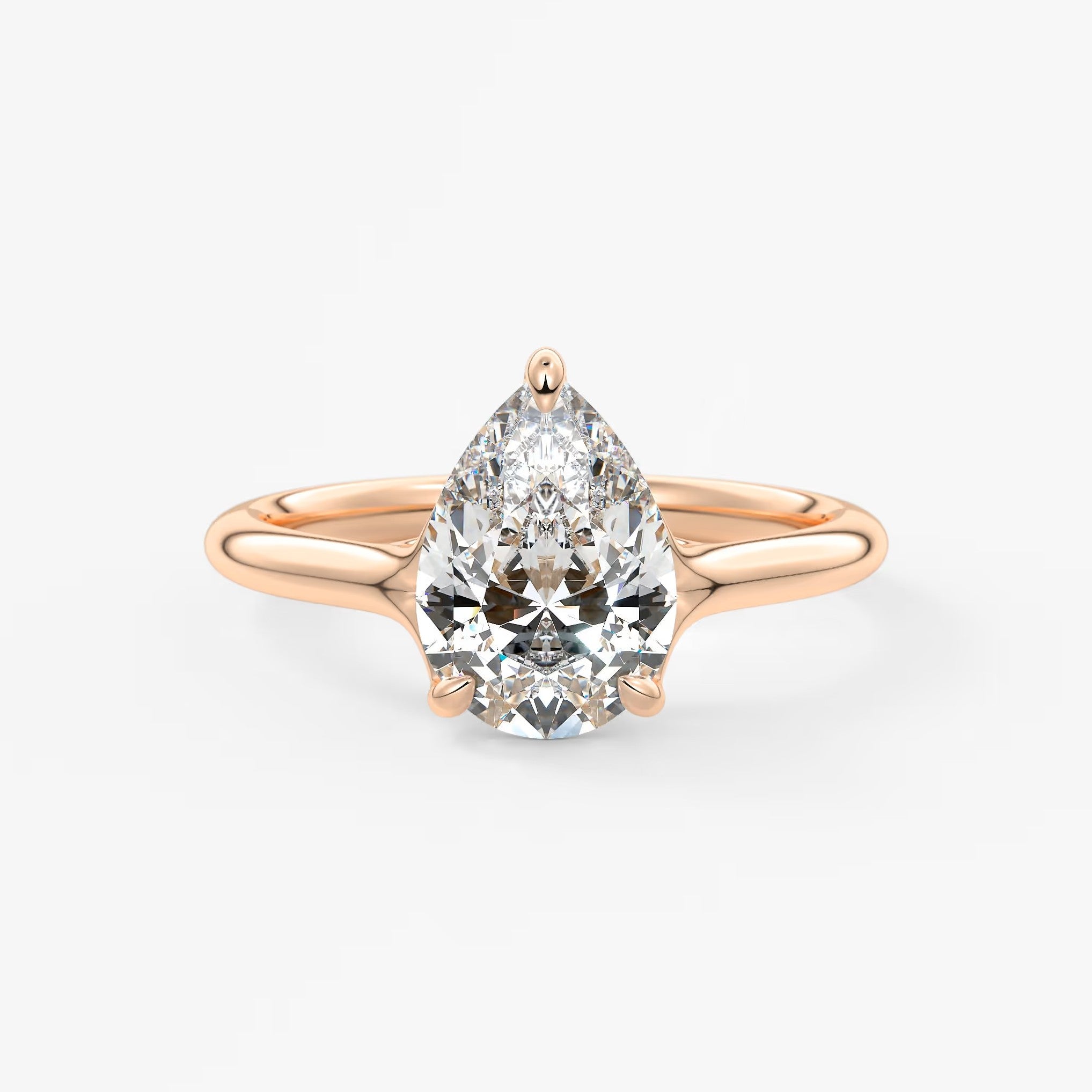 Cassia – pear solitaire with triple-claw prongs