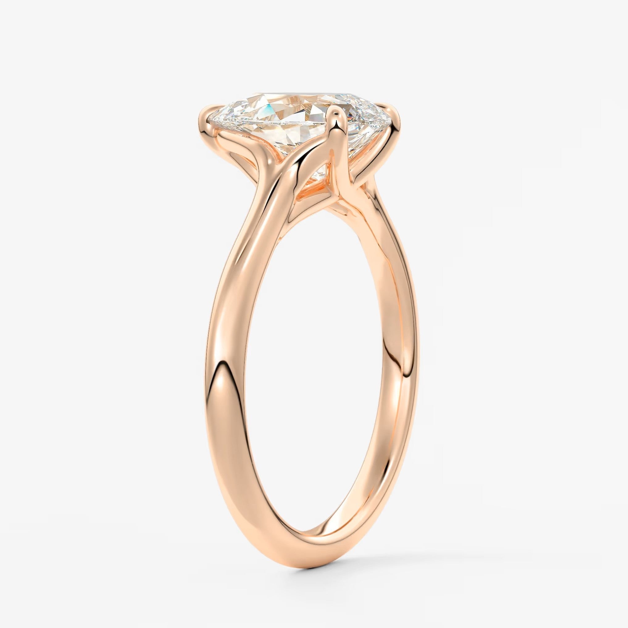 Cassia – pear solitaire with triple-claw prongs