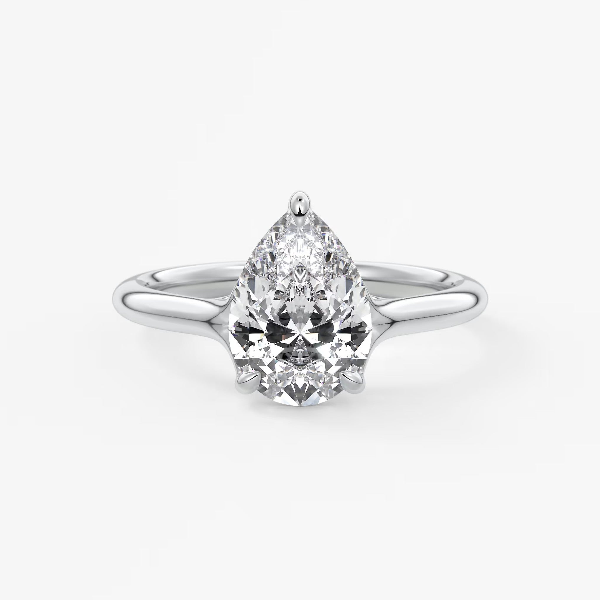 Cassia – pear solitaire with triple-claw prongs