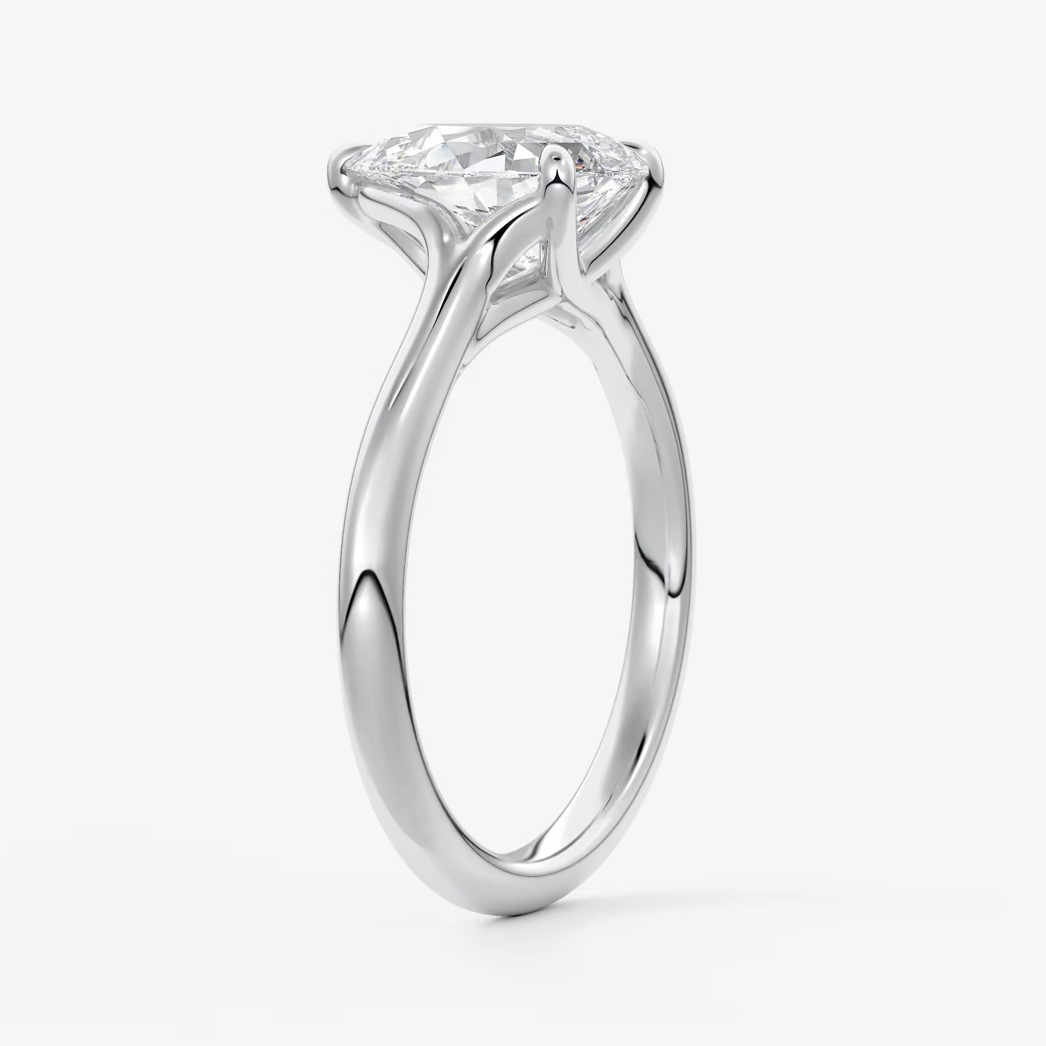 Cassia – pear solitaire with triple-claw prongs