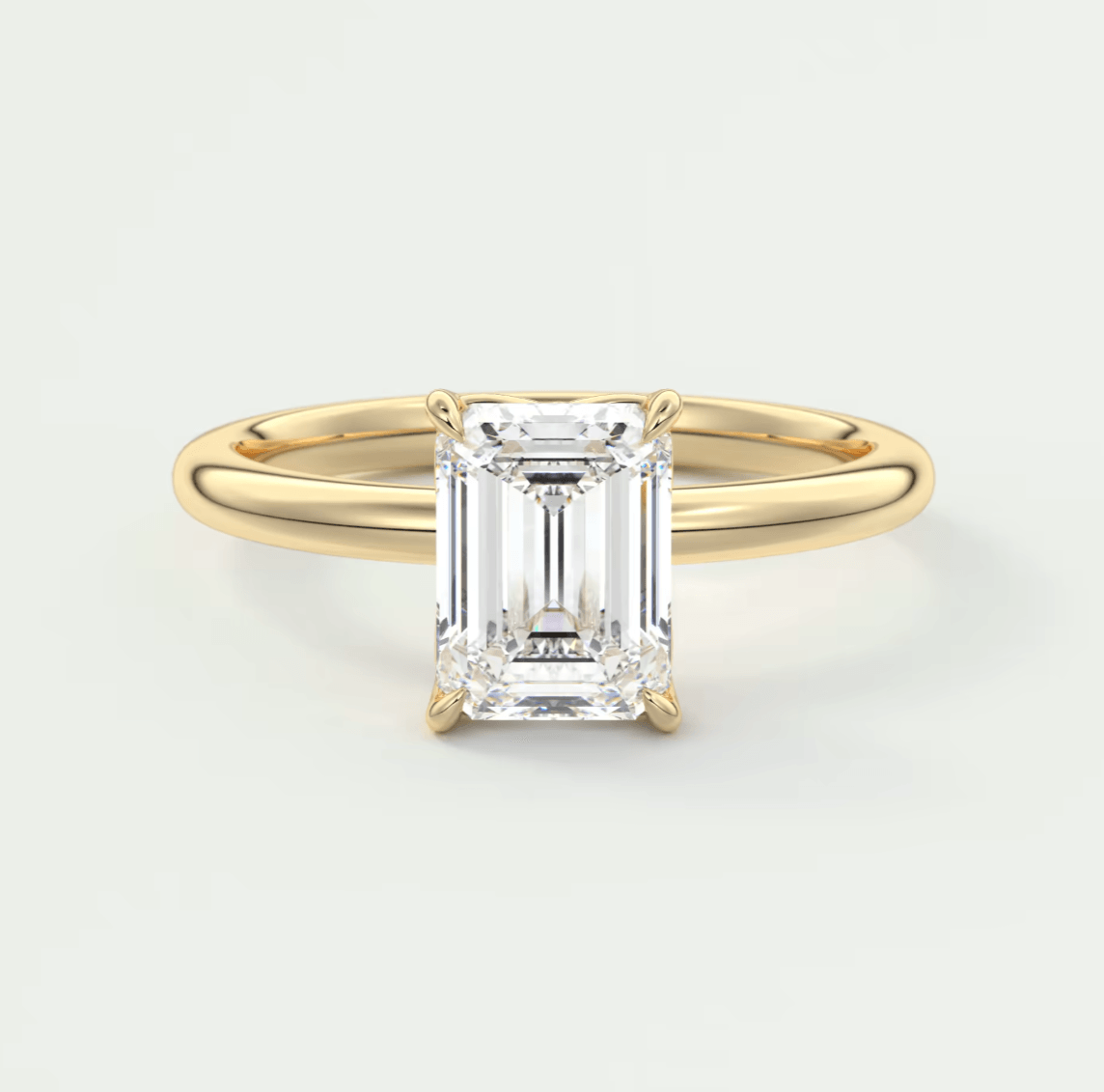 18k yellow gold emerald cut diamond engagement ring.