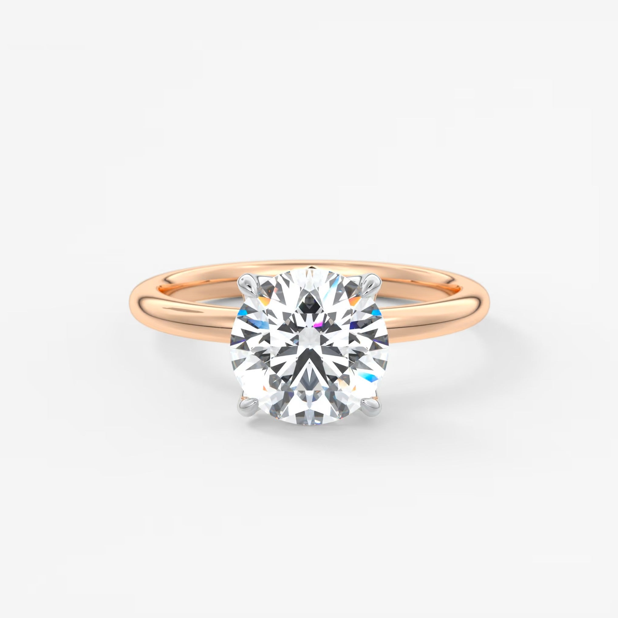Rose gold ring with a diamond on a white background