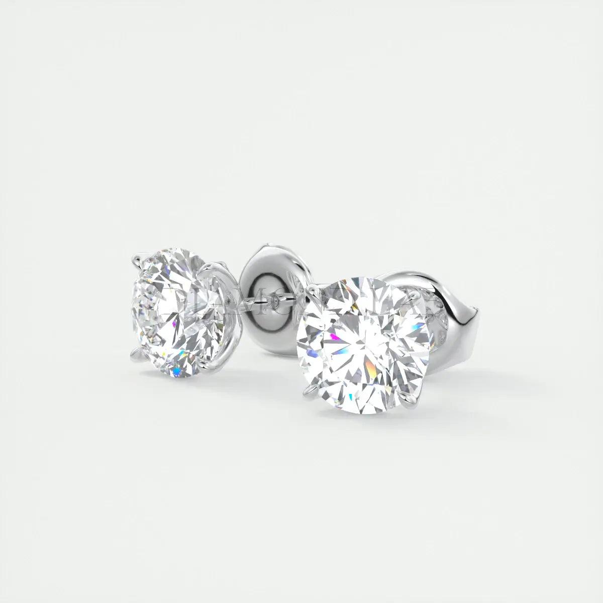 White diamond stud earrings with silver posts and backs.