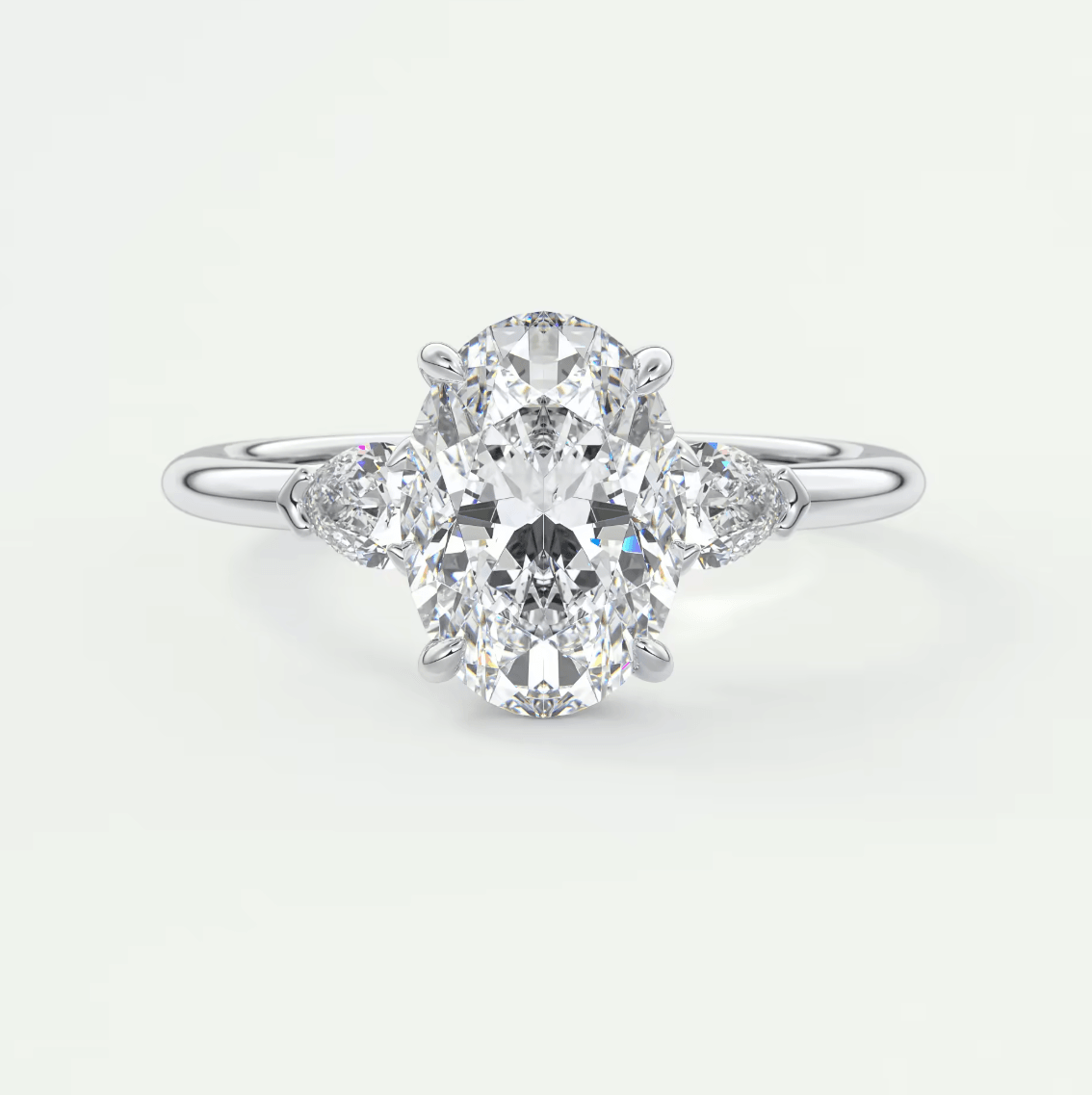 Elysian Oval with Pear Three-Stone Engagement Ring – Lab Diamond or Moissanite