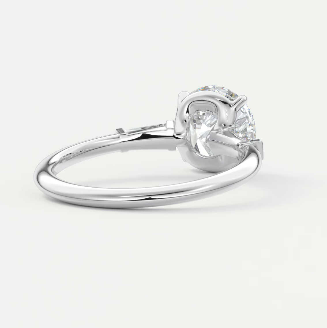 Elysian Round Three-Stone Engagement Ring with Tapered Baguettes