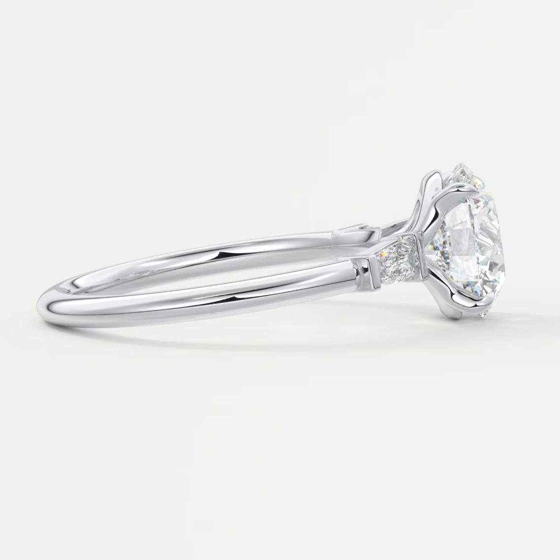 Elysian Round Three-Stone Engagement Ring with Tapered Baguettes