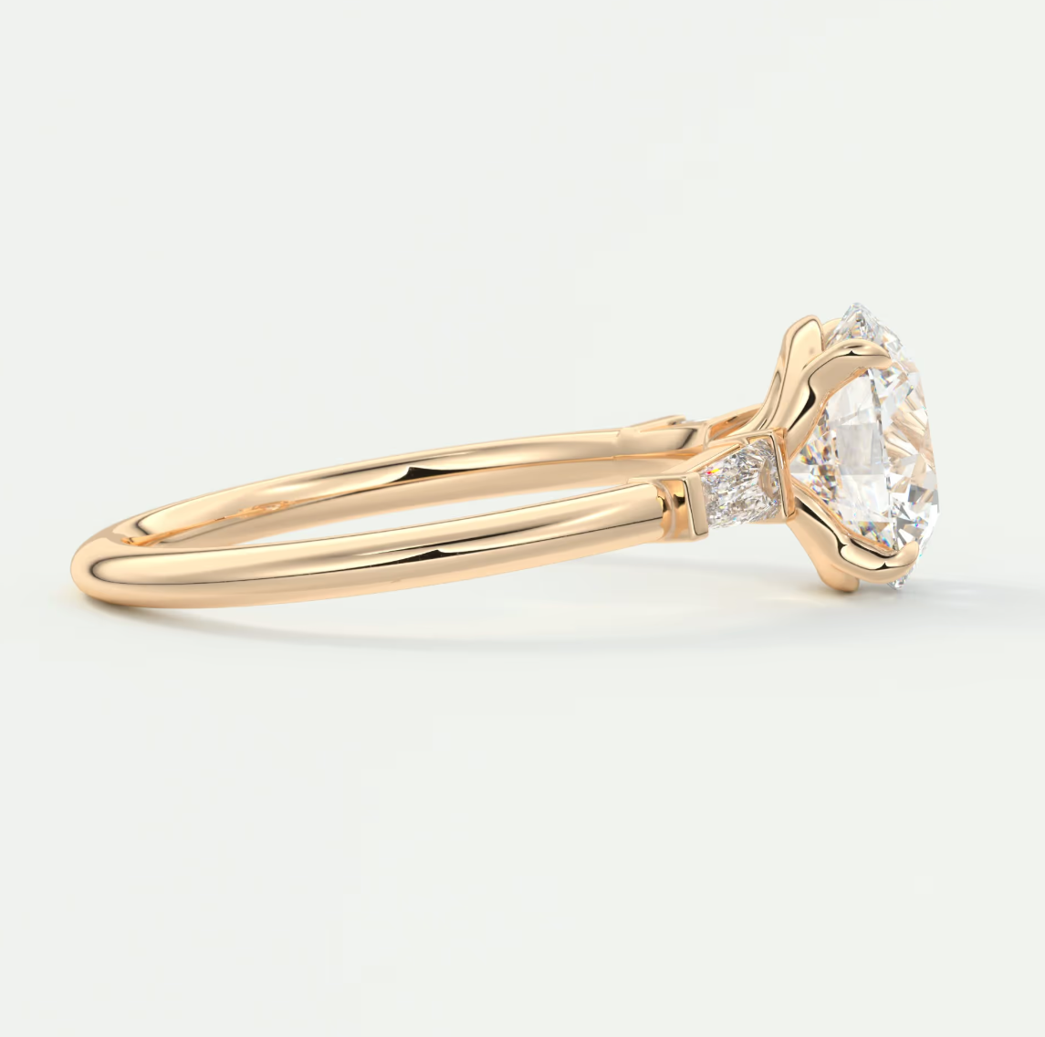 Elysian Round Three-Stone Engagement Ring with Tapered Baguettes