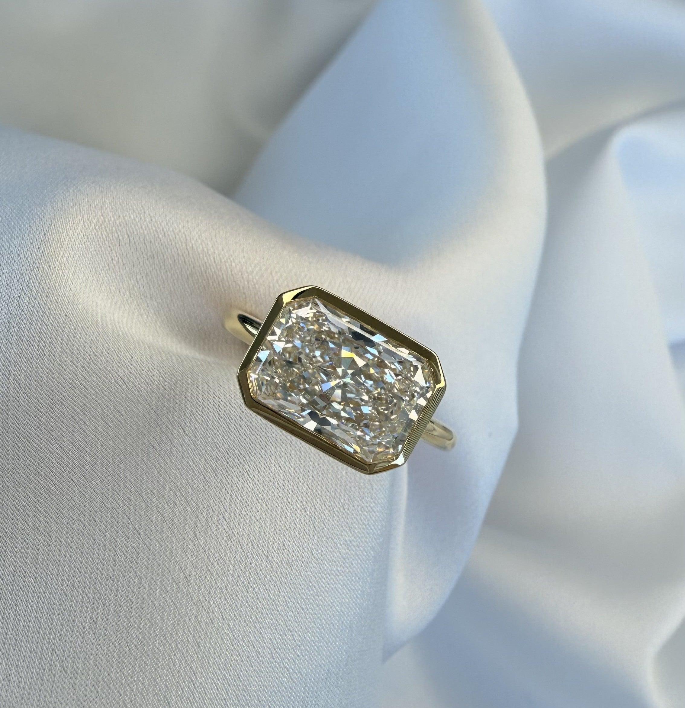 Veda East-West Radiant Bezel Lab Diamond Engagement Ring – 3.08ct D VVS2 | 18K Yellow Gold 1.8mm Band