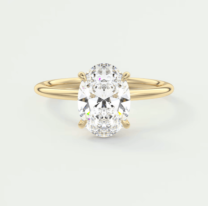 18k yellow gold oval diamond engagement ring with a solitaire design.