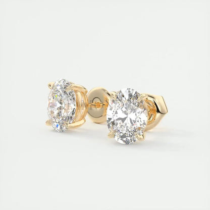 18-karat gold diamond stud earrings with a classic round-cut design.