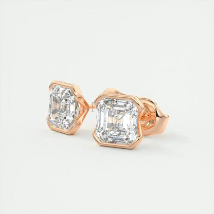 18k rose gold diamond stud earrings with a hexagonal bezel setting.