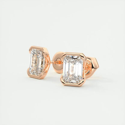 18-karat rose gold stud earrings with emerald-cut diamonds.