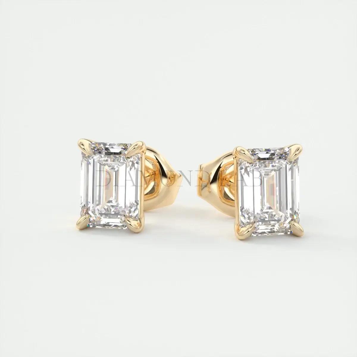18k yellow gold emerald-cut diamond stud earrings.