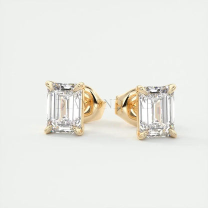 18k yellow gold emerald-cut diamond stud earrings.