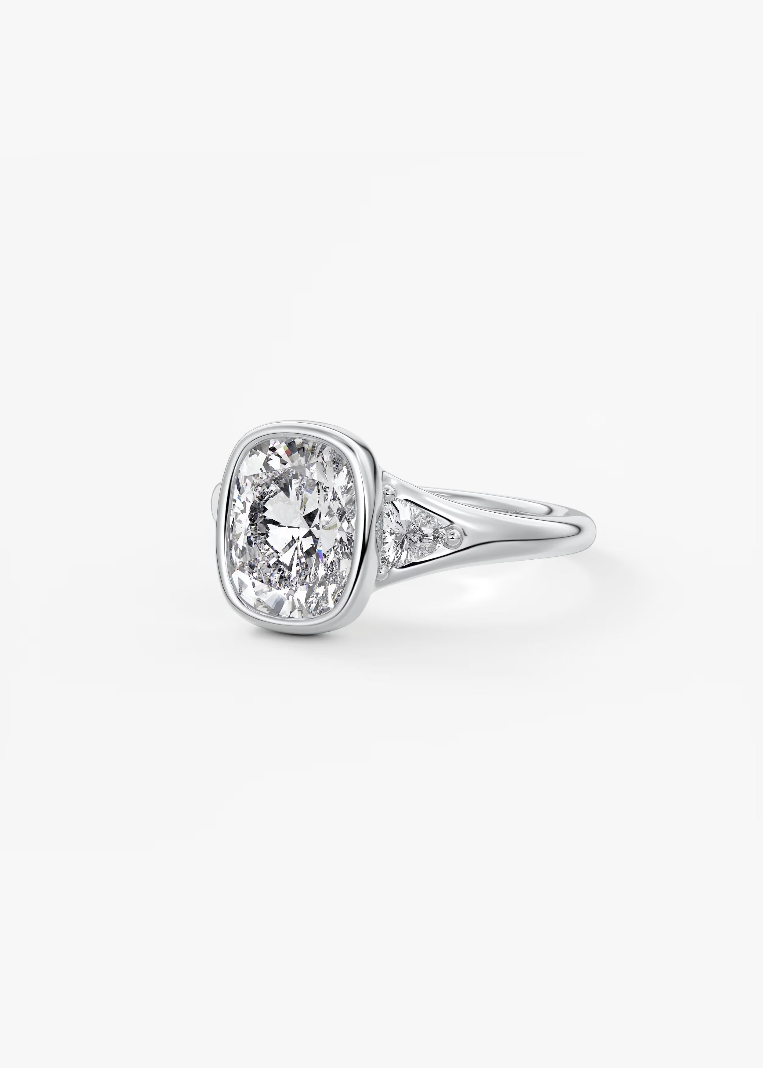 Véda Trilogy – Cushion with Trillion Side Stone Split Shank Engagement Ring