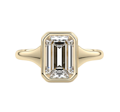 Gold ring with a large diamond on a white background