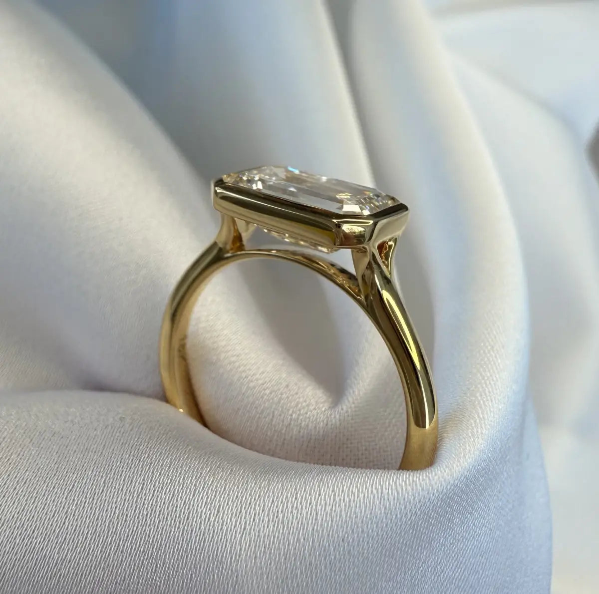 Custom made aeris east-west emerald bezel lab diamond ring 2.08ct d vvs2 | 18k yellow gold