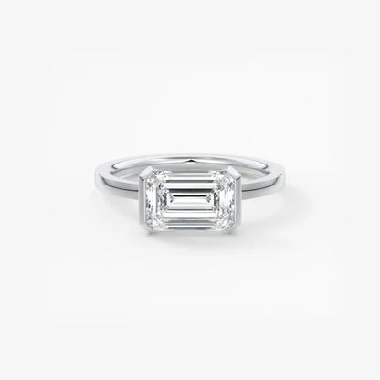 Custom made alosta emerald east-west half bezel engagement ring | lab diamond or moissanite