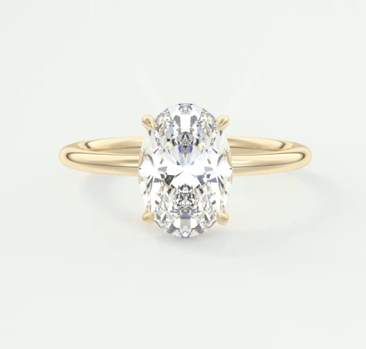 18k yellow gold oval diamond engagement ring with a solitaire design.