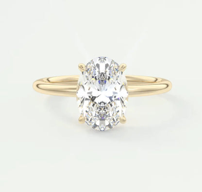 18k yellow gold oval diamond engagement ring with a solitaire design.