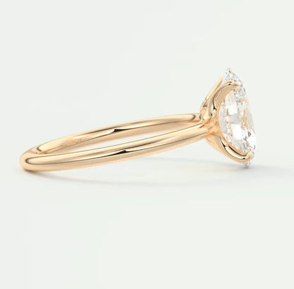 18k gold engagement ring with a marquise-cut diamond.