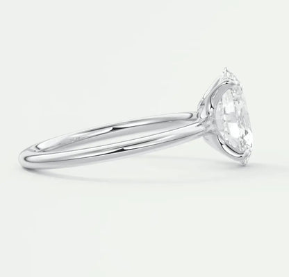 18-karat white gold solitaire engagement ring with a round diamond.