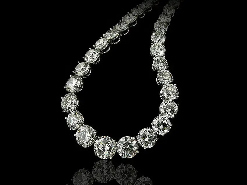 A dazzling diamond necklace with a sleek, continuous line of round-cut stones set in polished white gold.
