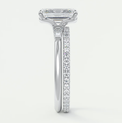 Custom made elysian emerald three-stone engagement ring with tapered baguettes