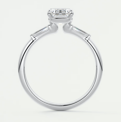 Custom made elysian emerald three-stone engagement ring with tapered baguettes