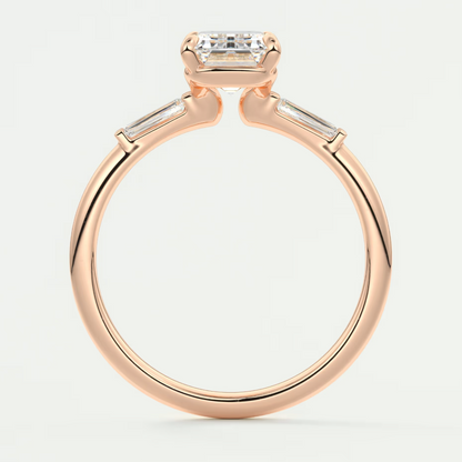 Custom made elysian emerald three-stone engagement ring with tapered baguettes