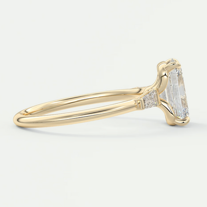 Custom made elysian emerald three-stone engagement ring with tapered baguettes