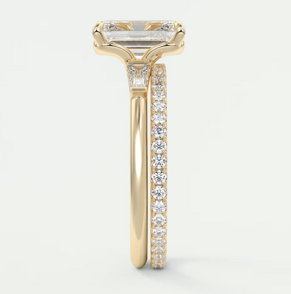 Custom made elysian emerald three-stone engagement ring with tapered baguettes