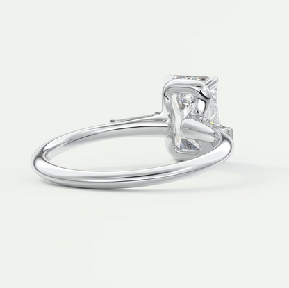 Custom made elysian emerald three-stone engagement ring with tapered baguettes