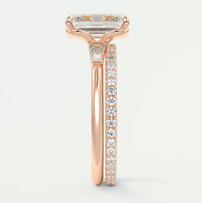 Custom made elysian emerald three-stone engagement ring with tapered baguettes