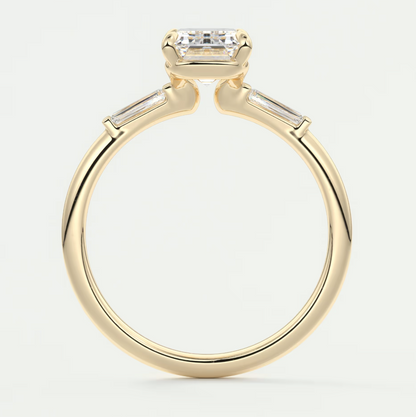 Custom made elysian emerald three-stone engagement ring with tapered baguettes