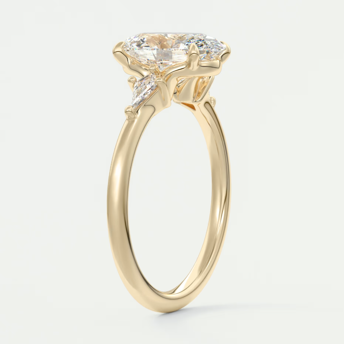 Custom made elysian oval three-stone engagement ring with kite side stones | diamond lab