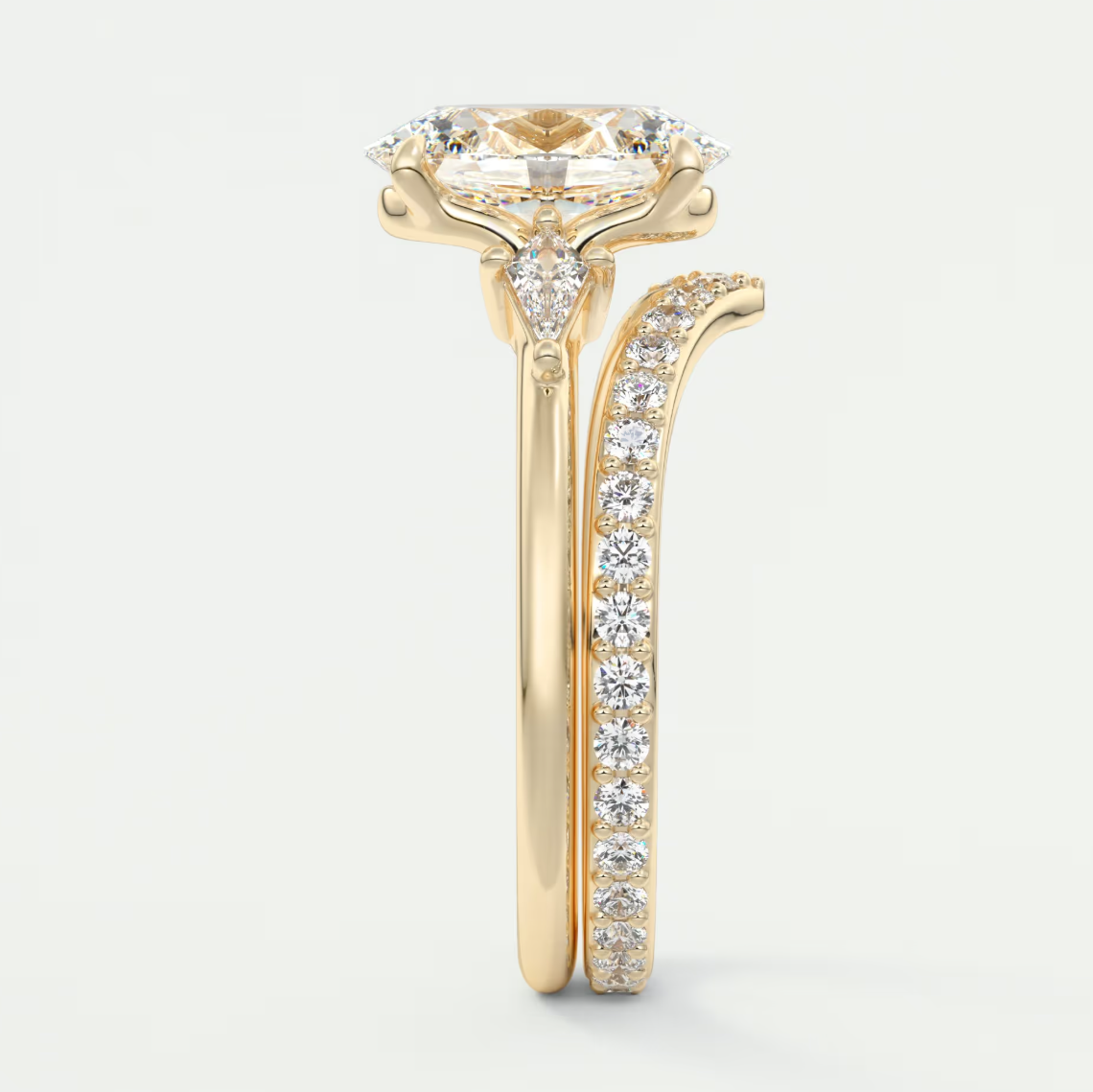 Custom made elysian oval three-stone engagement ring with kite side stones | diamond lab