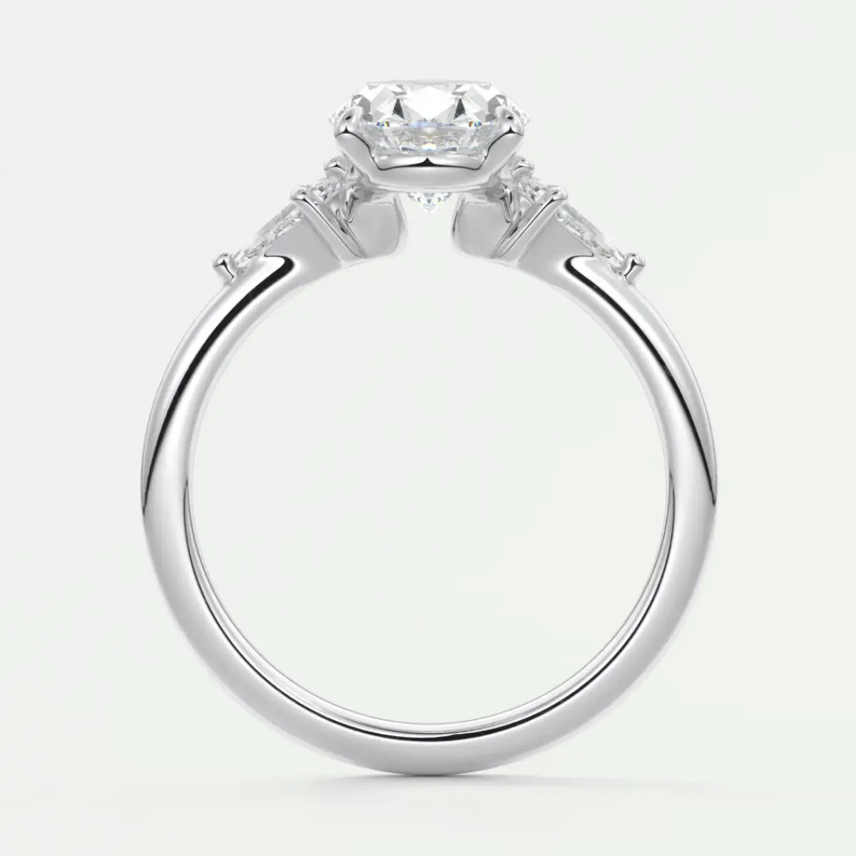 Custom made elysian oval three-stone engagement ring with kite side stones | diamond lab