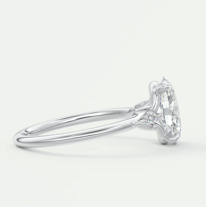 Custom made elysian oval three-stone engagement ring with kite side stones | diamond lab