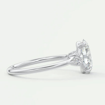 Custom made elysian oval three-stone engagement ring with kite side stones | diamond lab
