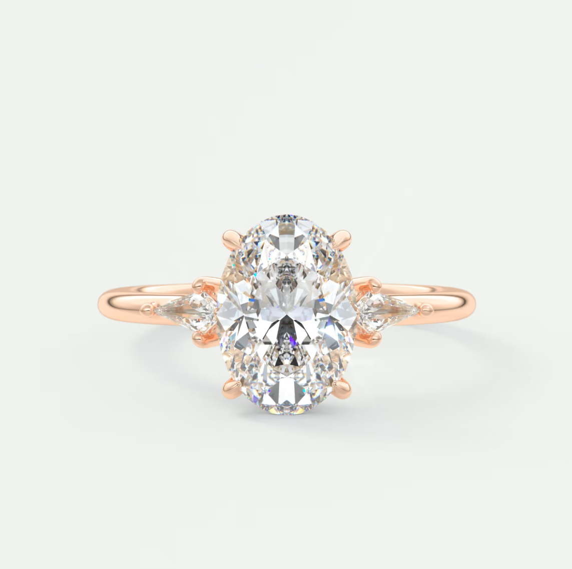 Custom made elysian oval three-stone engagement ring with kite side stones | diamond lab