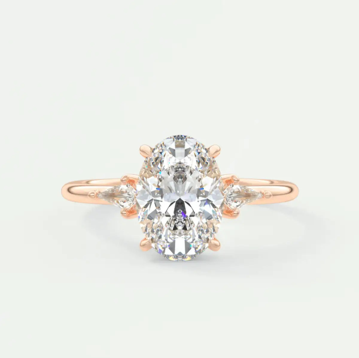 Custom made elysian oval three-stone engagement ring with kite side stones | diamond lab