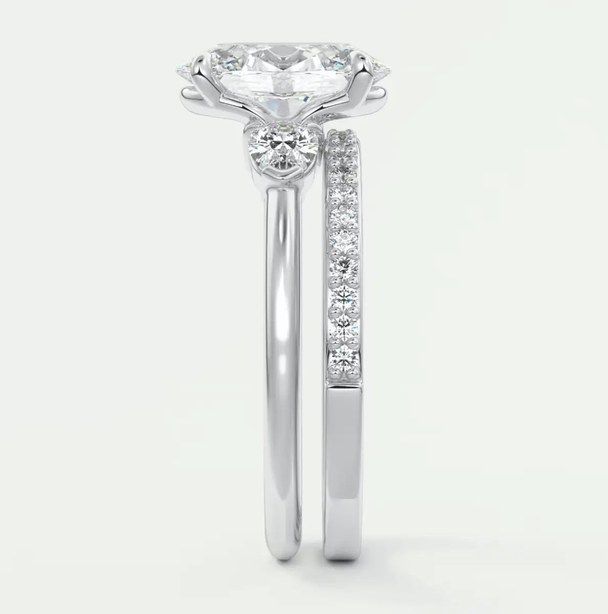 18k white gold diamond engagement ring with a round brilliant cut center stone and channel set diamonds on the band.