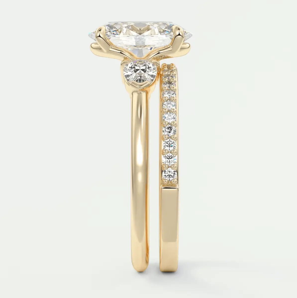18-karat yellow gold engagement ring with a round diamond center stone and channel-set diamonds on the band.