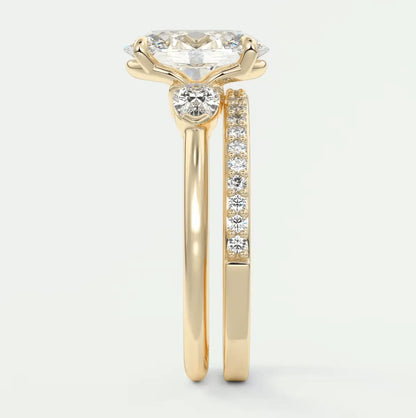 18-karat yellow gold engagement ring with a round diamond center stone and channel-set diamonds on the band.