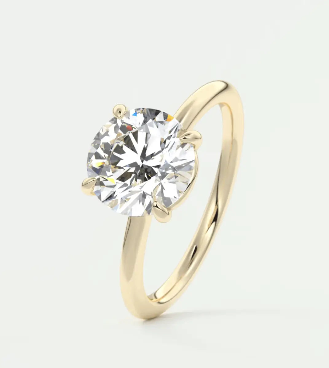 18k yellow gold solitaire diamond engagement ring.