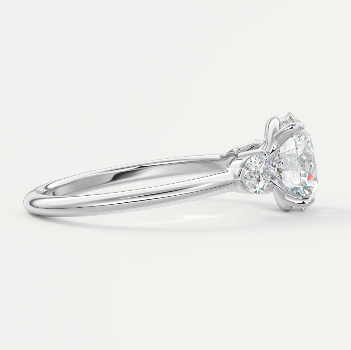 Custom made elysian round three-stone engagement ring with pear side stones | diamond lab